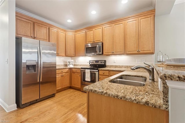 6885 Colemans Crossing Ave, Hayes, VA 23072 - kitchen with appliances with stainless steel finishes, light wood-style floors, light stone counters, a peninsula, and decorative backsplash