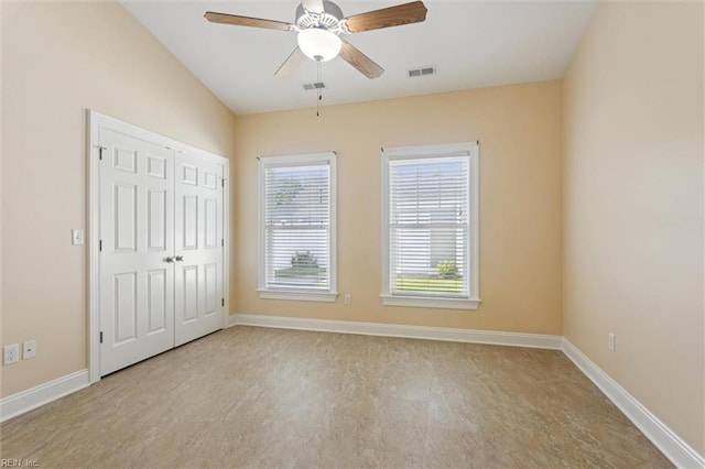 6885 Colemans Crossing Ave, Hayes, VA 23072 - unfurnished bedroom featuring vaulted ceiling, a ceiling fan, and a closet