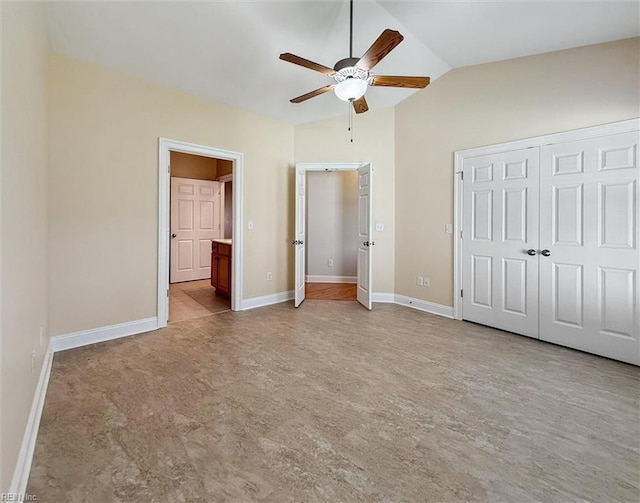 6885 Colemans Crossing Ave, Hayes, VA 23072 - unfurnished bedroom featuring vaulted ceiling, a closet, connected bathroom, and a ceiling fan