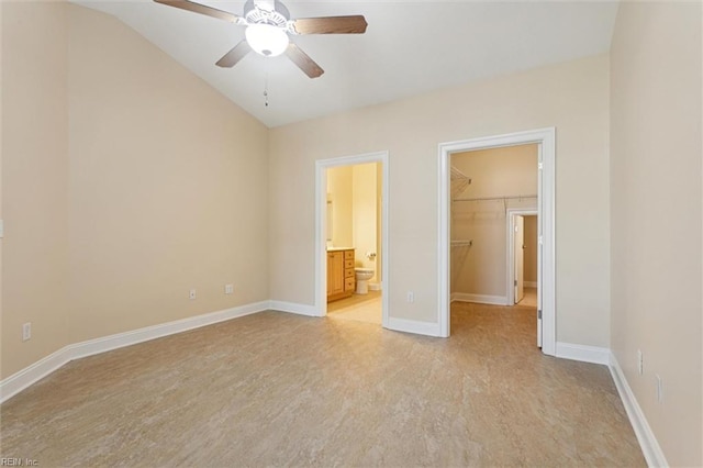 6885 Colemans Crossing Ave, Hayes, VA 23072 - unfurnished bedroom featuring a walk in closet, lofted ceiling, a closet, ensuite bathroom, and a ceiling fan