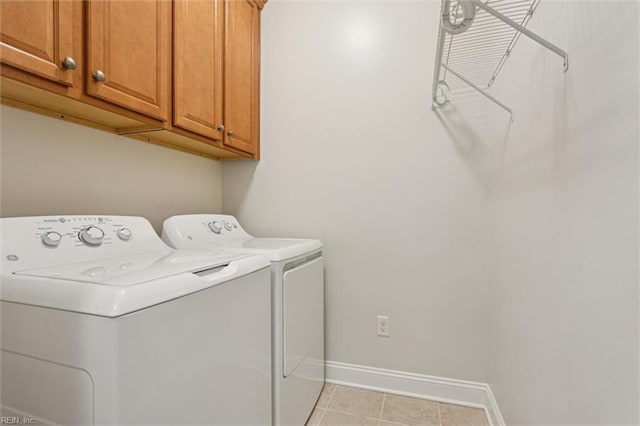 6885 Colemans Crossing Ave, Hayes, VA 23072 - laundry area with washing machine and dryer, cabinet space, and light tile patterned flooring