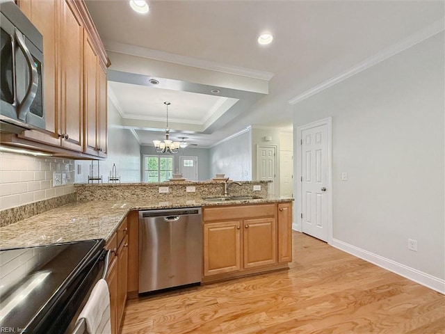 6885 Colemans Crossing Ave, Hayes, VA 23072 - kitchen with stainless steel appliances, a chandelier, light wood-style floors, ornamental molding, and a peninsula