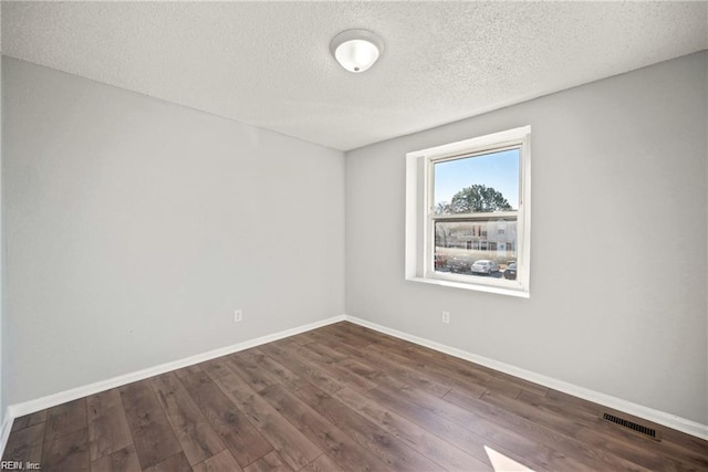 3720 Northwood Ct, Virginia Beach, VA 23452 - unfurnished room with dark wood-type flooring and a textured ceiling