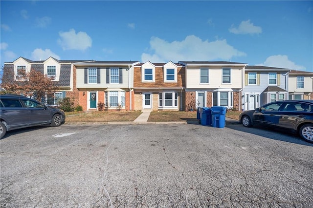 3720 Northwood Ct, Virginia Beach, VA 23452 - view of property featuring brick siding, a residential view, and uncovered parking