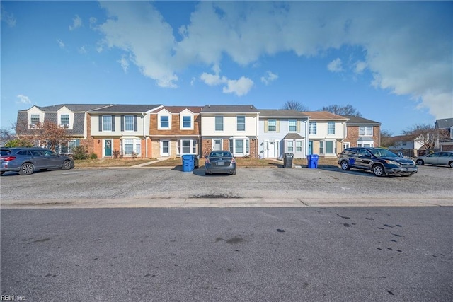 3720 Northwood Ct, Virginia Beach, VA 23452 - view of property featuring uncovered parking, a residential view, and brick siding
