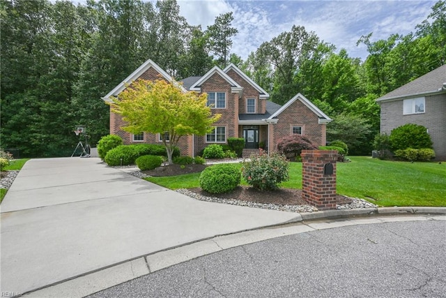 409 Torre Pine Ct, Chesapeake, VA 23322 - traditional-style home featuring brick siding and a front yard