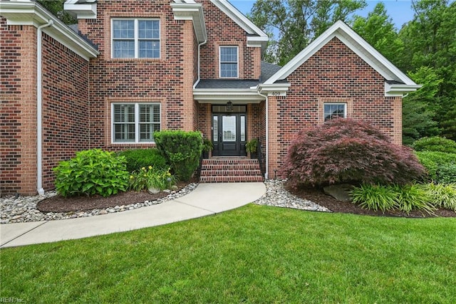 409 Torre Pine Ct, Chesapeake, VA 23322 - traditional-style home featuring a front lawn and brick siding