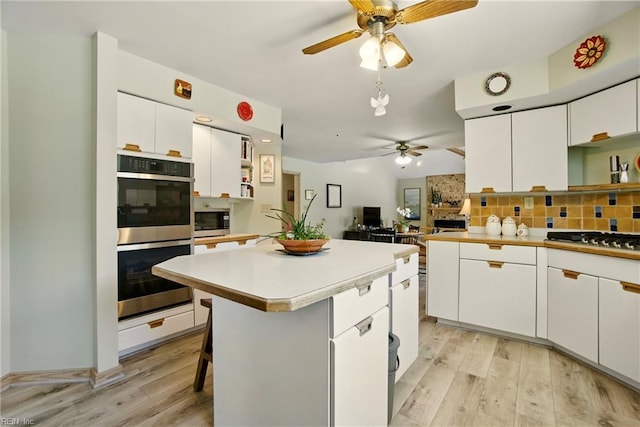 1737 Pleasant Ridge Rd, Virginia Beach, VA 23457 - kitchen with stainless steel appliances, ceiling fan, open shelves, and white cabinets
