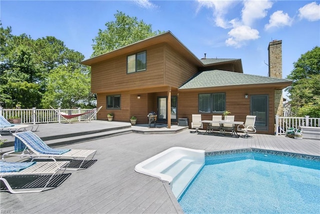 1737 Pleasant Ridge Rd, Virginia Beach, VA 23457 - rear view of house featuring a deck, roof with shingles, a chimney, and outdoor dining area