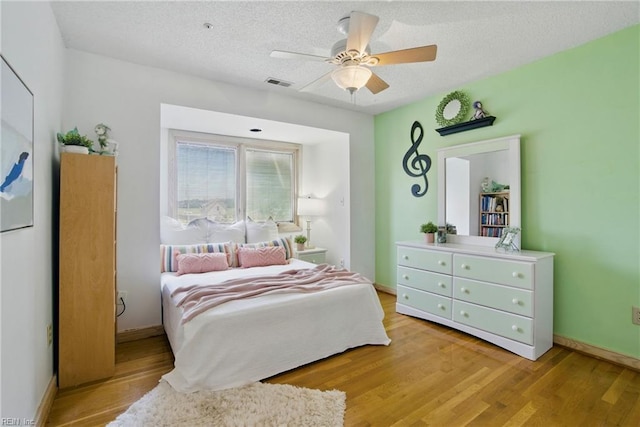 1737 Pleasant Ridge Rd, Virginia Beach, VA 23457 - bedroom featuring light wood-style floors, a textured ceiling, and a ceiling fan