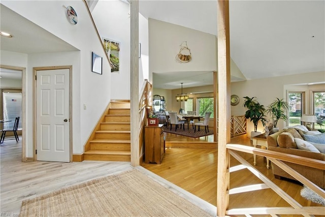 1737 Pleasant Ridge Rd, Virginia Beach, VA 23457 - staircase featuring wood finished floors, a chandelier, and high vaulted ceiling