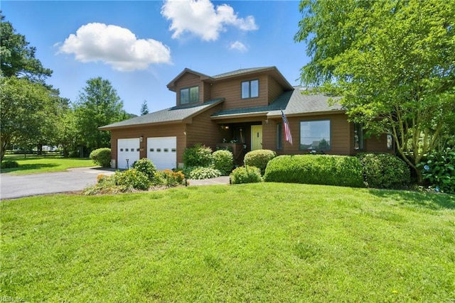 1737 Pleasant Ridge Rd, Virginia Beach, VA 23457 - view of front of house with asphalt driveway, a front yard, and a garage