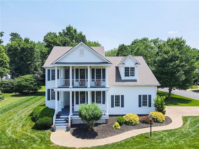 20517 Madison Ct, Smithfield, VA 23430 - neoclassical home with a balcony, a porch, a front lawn, and roof with shingles
