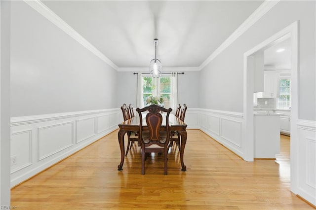 20517 Madison Ct, Smithfield, VA 23430 - dining area with plenty of natural light, a wainscoted wall, a decorative wall, light wood-type flooring, and ornamental molding