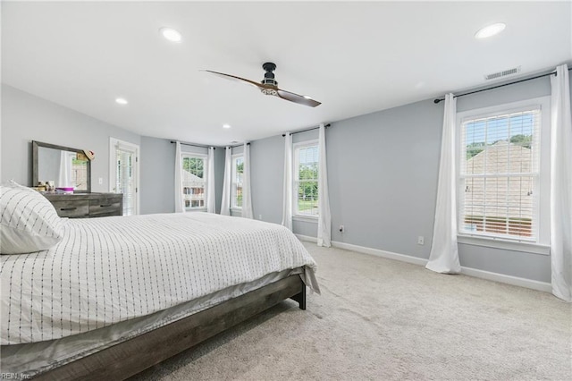 20517 Madison Ct, Smithfield, VA 23430 - carpeted bedroom with recessed lighting, multiple windows, and a ceiling fan