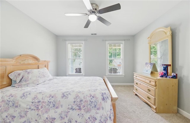 20517 Madison Ct, Smithfield, VA 23430 - bedroom with light carpet and a ceiling fan