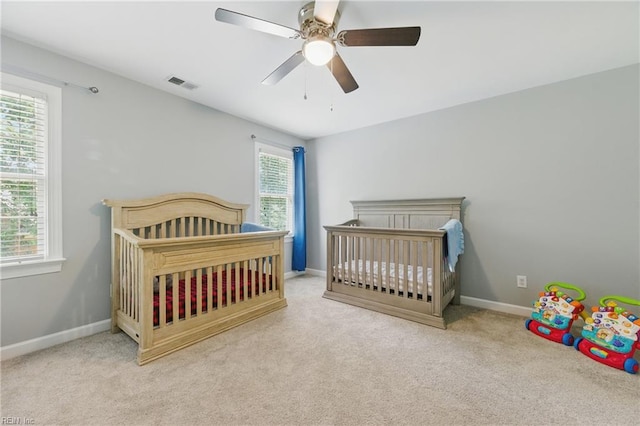 20517 Madison Ct, Smithfield, VA 23430 - carpeted bedroom with ceiling fan and a nursery area