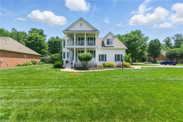 20517 Madison Ct, Smithfield, VA 23430 - back of house with a balcony, a porch, and a lawn