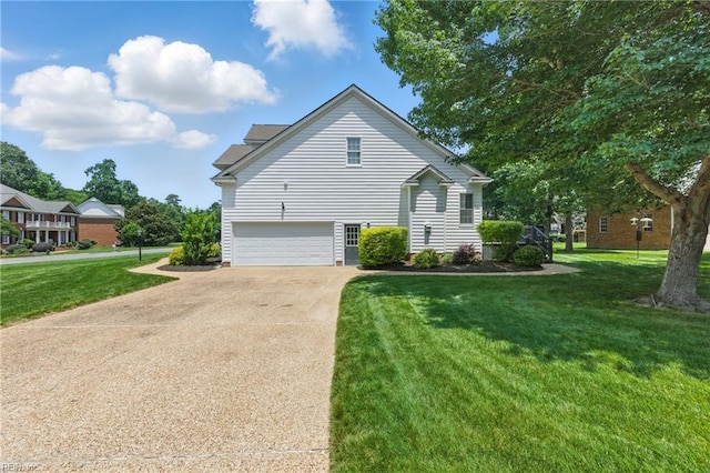 20517 Madison Ct, Smithfield, VA 23430 - view of property exterior featuring concrete driveway, a yard, and a garage