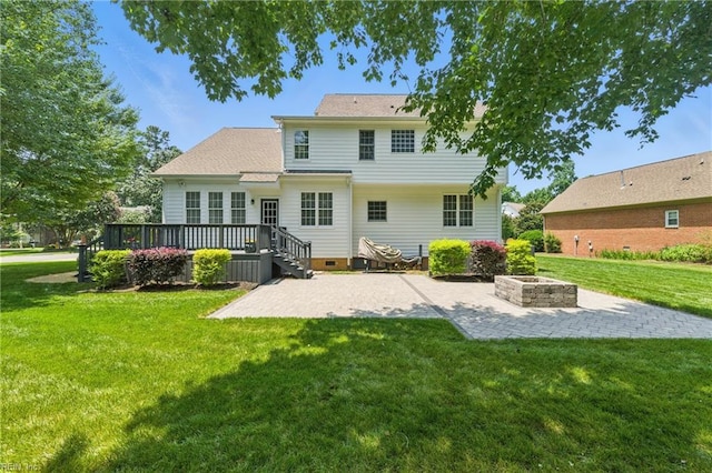 20517 Madison Ct, Smithfield, VA 23430 - back of house featuring a patio, a deck, crawl space, an outdoor fire pit, and a lawn