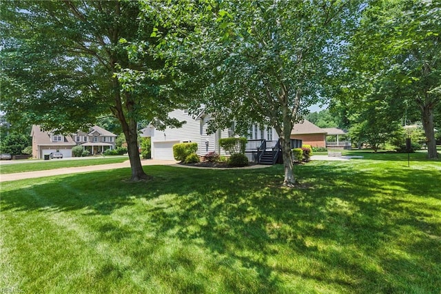 20517 Madison Ct, Smithfield, VA 23430 - view of property hidden behind natural elements with a front yard, driveway, and a garage