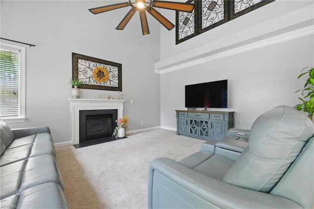 20517 Madison Ct, Smithfield, VA 23430 - carpeted living room with a ceiling fan, a towering ceiling, and a fireplace with flush hearth