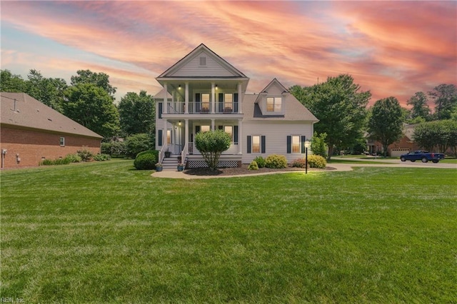 20517 Madison Ct, Smithfield, VA 23430 - greek revival house featuring a balcony, a front lawn, and covered porch