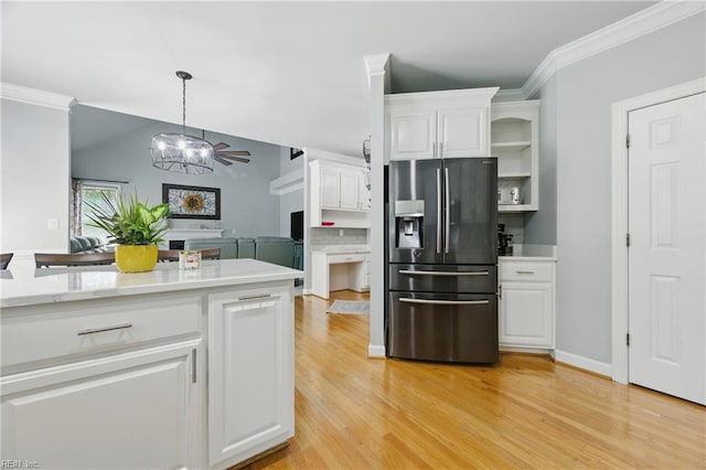 20517 Madison Ct, Smithfield, VA 23430 - kitchen featuring stainless steel fridge, white cabinets, light countertops, ornamental molding, and light wood-type flooring