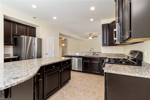 3112 Sybilla St, Chesapeake, VA 23323 - kitchen featuring stainless steel appliances, ceiling fan, light stone counters, light tile patterned floors, and recessed lighting