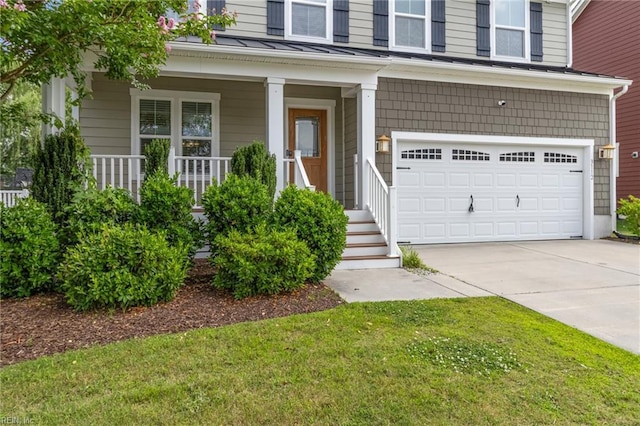 3112 Sybilla St, Chesapeake, VA 23323 - doorway to property featuring a garage, driveway, a standing seam roof, covered porch, and a metal roof