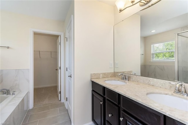 3112 Sybilla St, Chesapeake, VA 23323 - full bathroom featuring double vanity, a stall shower, a garden tub, tile patterned flooring, and a spacious closet