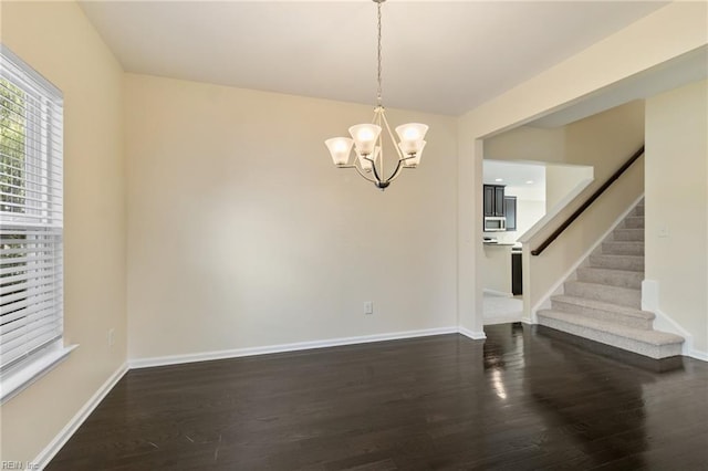 3112 Sybilla St, Chesapeake, VA 23323 - unfurnished dining area with dark wood finished floors, stairs, and a chandelier