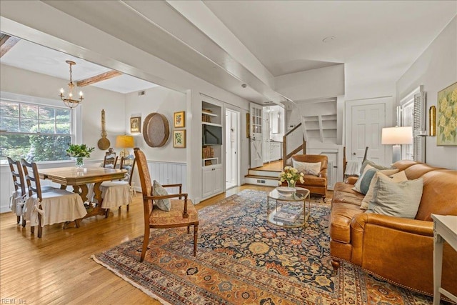 537 Cavalier Dr, Virginia Beach, VA 23451 - living area with a chandelier, wood finished floors, a wainscoted wall, stairway, and built in features
