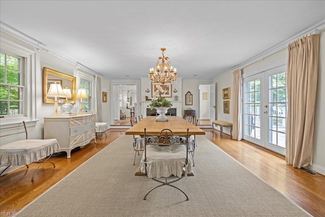 537 Cavalier Dr, Virginia Beach, VA 23451 - dining room featuring ornamental molding, french doors, wood finished floors, and a chandelier