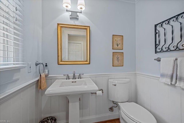 537 Cavalier Dr, Virginia Beach, VA 23451 - bathroom featuring toilet and a wainscoted wall