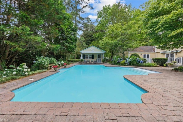537 Cavalier Dr, Virginia Beach, VA 23451 - outdoor pool featuring an exterior structure, an outbuilding, and a patio area
