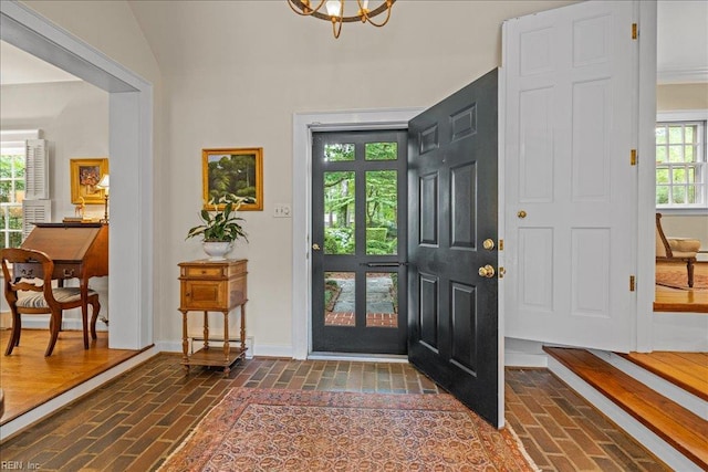 537 Cavalier Dr, Virginia Beach, VA 23451 - entryway featuring brick flooring and a chandelier