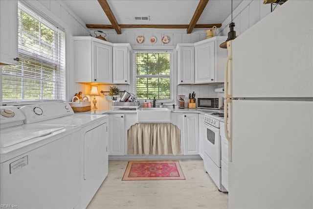 537 Cavalier Dr, Virginia Beach, VA 23451 - laundry area featuring washing machine and clothes dryer and healthy amount of natural light