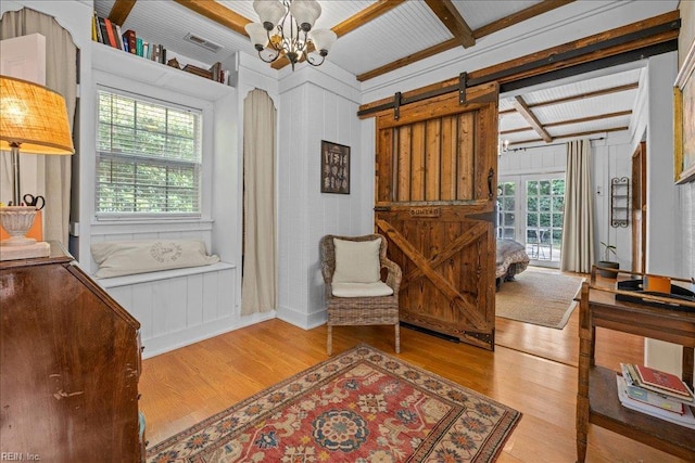 537 Cavalier Dr, Virginia Beach, VA 23451 - sitting room with wood finished floors, a chandelier, and a barn door