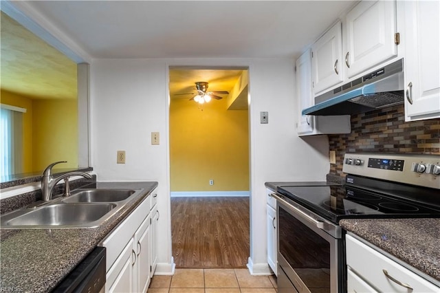 3724 Radford Cir, Chesapeake, VA 23321 - kitchen featuring stainless steel electric stove, under cabinet range hood, dark countertops, ceiling fan, and white cabinetry