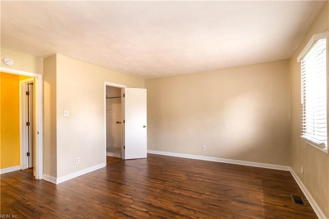3724 Radford Cir, Chesapeake, VA 23321 - unfurnished bedroom with dark wood-type flooring and a walk in closet