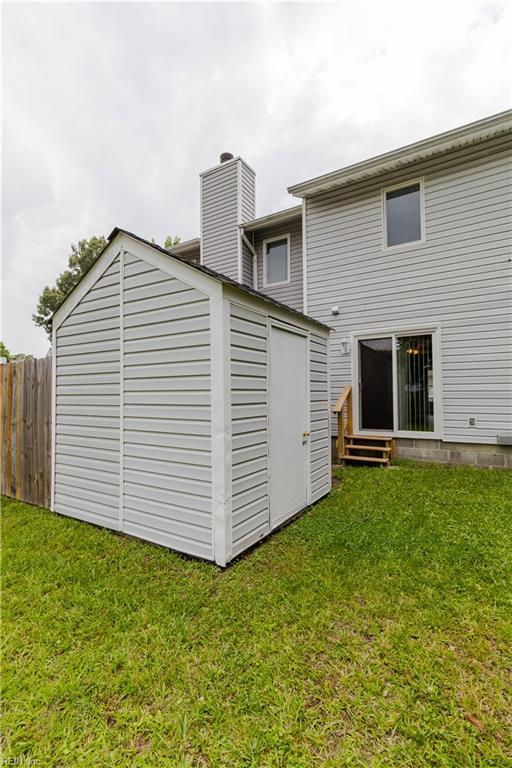 3724 Radford Cir, Chesapeake, VA 23321 - back of house featuring entry steps, a chimney, and a storage unit