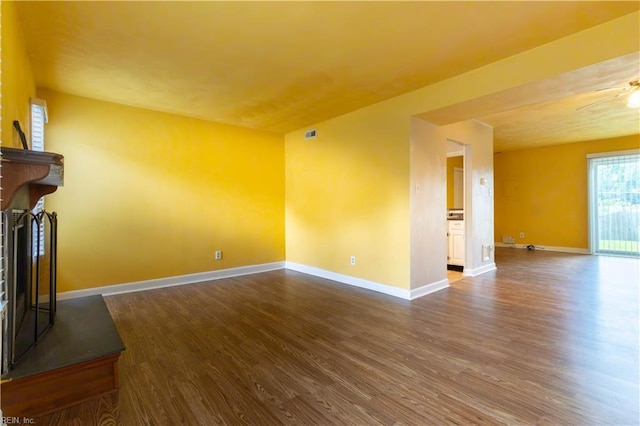 3724 Radford Cir, Chesapeake, VA 23321 - unfurnished living room with wood finished floors, a fireplace with raised hearth, and a ceiling fan