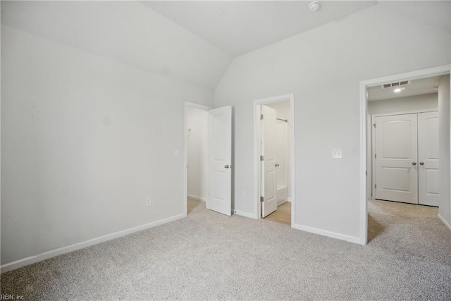 453 Asuza St, Chesapeake, VA 23323 - unfurnished bedroom with light colored carpet, lofted ceiling, and connected bathroom