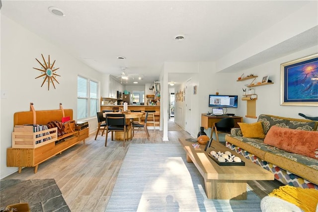1509 Cypress Ave, Virginia Beach, VA 23451 - living area featuring light wood-type flooring and ceiling fan