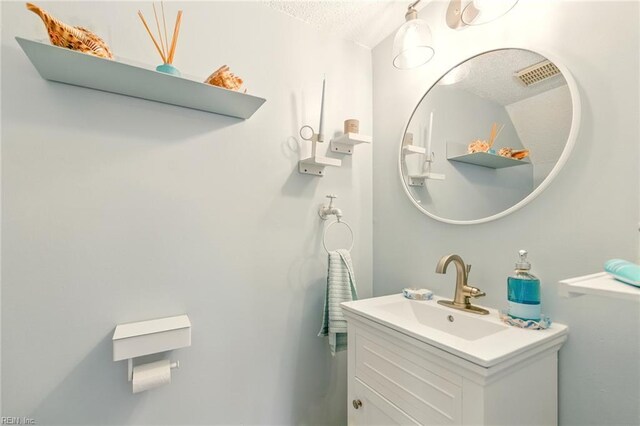 1509 Cypress Ave, Virginia Beach, VA 23451 - bathroom featuring a textured ceiling and vanity