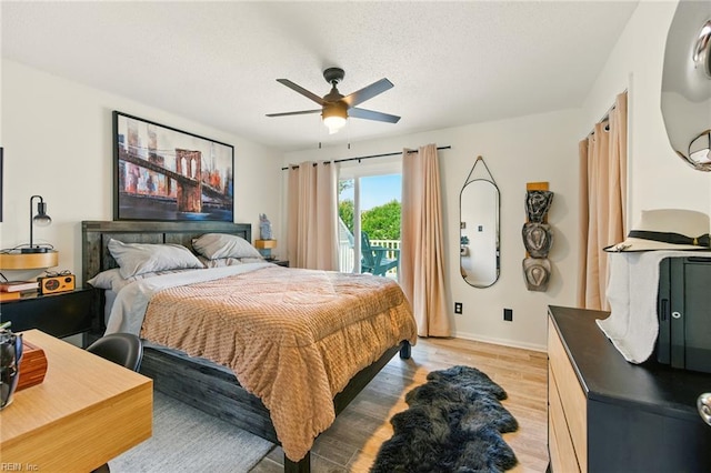 1509 Cypress Ave, Virginia Beach, VA 23451 - bedroom featuring access to exterior, light wood-style floors, a ceiling fan, and a textured ceiling