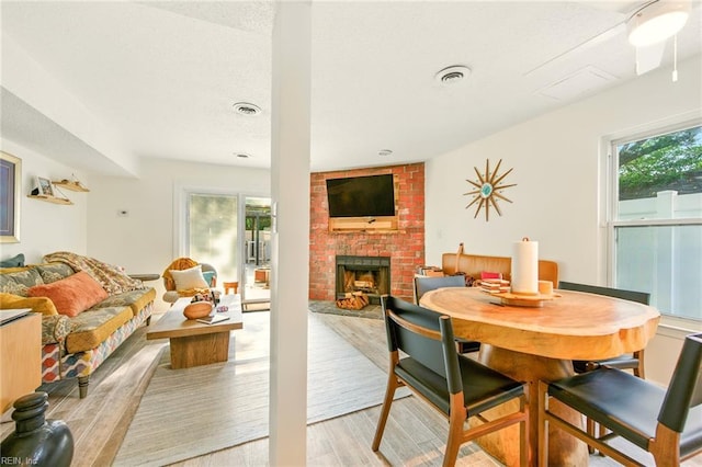 1509 Cypress Ave, Virginia Beach, VA 23451 - dining area with light wood finished floors and a fireplace