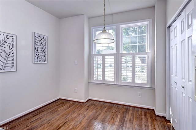 6667 Rexford Ln, Williamsburg, VA 23188 - unfurnished dining area featuring wood finished floors and baseboards