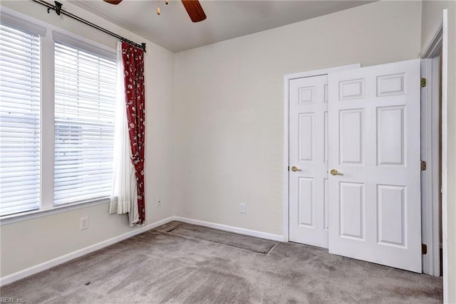 6667 Rexford Ln, Williamsburg, VA 23188 - unfurnished bedroom with carpet flooring, multiple windows, and ceiling fan